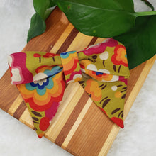 Load image into Gallery viewer, Custom Order - Bows. Help your pup put their best paw forward by wearing one of these pretty bows on their collar. Worn to the side, up front or at the back, its versatility makes dressing up an everyday possibility! This collar bow is suitable as a cat collar and a dog collar.  Measures 5.5” at its widest point. Made from 100% cotton fabric in a variety of patterns. Fastens to collars up to 1” wide. Elastic and snap fastener. Wiggles and Whiskers Canada Pet Accessories.