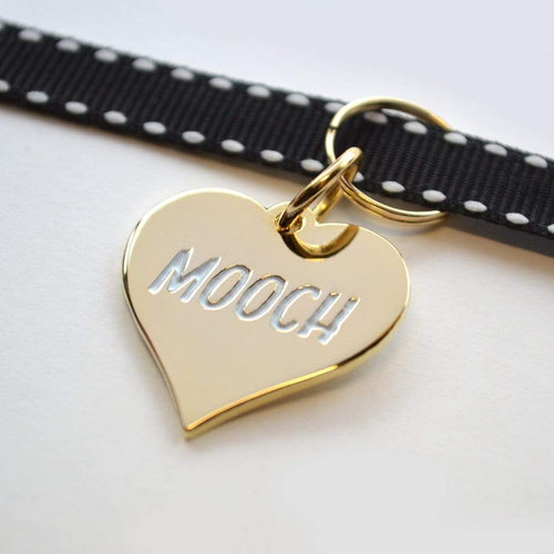 Gold Plated Mooch Pet Tag. Sure, your pet doesn't have a job or chip in for groceries, but they are adorable so who cares. Award them with this gold medal from Canadian company Boldfaced Goods. Shiny backing perfect for engraving their name/number. Can also be worn as a pendant necklace for humans. Gold plated zinc alloy. Wiggles and Whiskers Canada Pet Accessories.