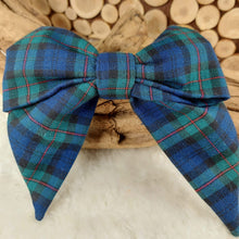 Load image into Gallery viewer, Plaid Collar Bow. Help your pup put their best paw forward by wearing one of these pretty bows on their collar. Worn to the side, up front or at the back, its versatility makes dressing up an everyday possibility! This collar bow is suitable as a cat collar and a dog collar. Measures 5.5” at its widest point. Made from 100% cotton fabric in a variety of patterns. Fastens to collars up to 1” wide. Elastic and snap fastener. Wiggles and Whiskers Canada Pet Accessories.