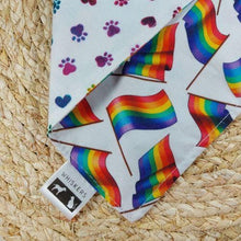 Load image into Gallery viewer, PRIDE month with this reversible pet bandana and matching hair scrunchie at one Special price! This Snap-On bandana is fully reversible with two coordinating 100% cotton fabrics. It falls in between a size small and medium and would best fit a pup with a neck circumference from 13.5&quot; to 16.5&quot; in diameter.Wiggles &amp; Whiskers. Pet Accessories Canada.
