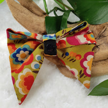 Load image into Gallery viewer, Custom Order - Bows. Help your pup put their best paw forward by wearing one of these pretty bows on their collar. Worn to the side, up front or at the back, its versatility makes dressing up an everyday possibility! This collar bow is suitable as a cat collar and a dog collar.  Measures 5.5” at its widest point. Made from 100% cotton fabric in a variety of patterns. Fastens to collars up to 1” wide. Elastic and snap fastener. Wiggles and Whiskers Canada Pet Accessories.
