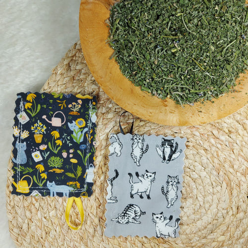 100% cotton fabric. Each pouch measures 3” x 4” with edges finished using pinking shears to reduce fraying. Double stitched for extra durability to withstand vigorous play. Includes a 1” loop of securely attached ribbon allowing it to be attached to a string for an additional mode of play. Contains 4 grams of catnip and catmint grown and dried in St. Jacobs, ON. Hanging your catnip pouch to dry after each use will ensure many months of use. Wiggles and Whiskers Canada Pet Accessories.