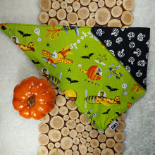 Load image into Gallery viewer, dog bandana made out of halloween themed fabrics folded almost in half and laying flat on runner made of wood cutouts on top of white faux fur with small fake pumpkin beside it. Halloween Bandanas. Canadian Pet Accessories Company Wiggles &amp; Whiskers
