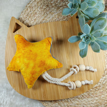 Load image into Gallery viewer, Stimulate all your cat’s senses with this catnip toy! Bright yellow cotton fabric on one side, and cute moon, sun and stars flannel fabric on the other. Measures 5.5” across and 11” in total length. This catnip toy is yellow and orange on one side . The other side of this catnip toy is blue with decorative moon prints. Wiggles &amp; Whiskers. Pet Accessories Canada.
