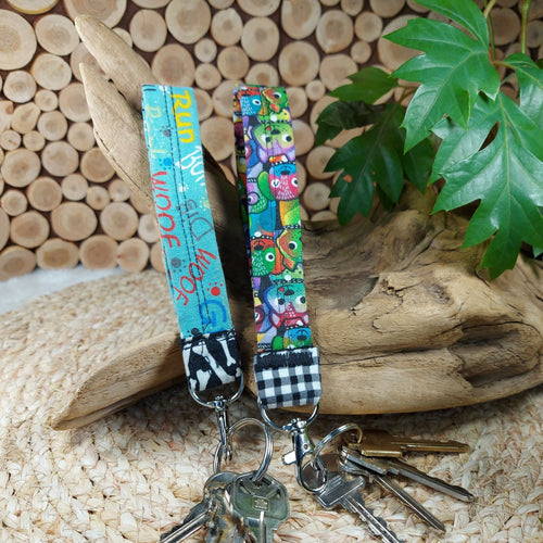 Carry your keys in style with these wrist lanyards made in various pet themed fabrics. 'Dog Words' Version - Measures 5.5
