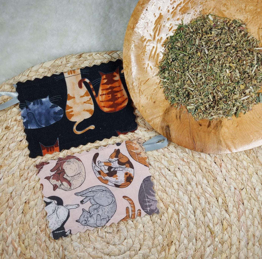Sleepy Cats Catnip Pouches - Set of 2 Handmade using quality 100% cotton fabric. Each pouch measures  a minimum of 3” x 4” with edges finished using pinking shears to reduce fraying. Wiggles & Whiskers Canada. Pet Accessories Canada.
