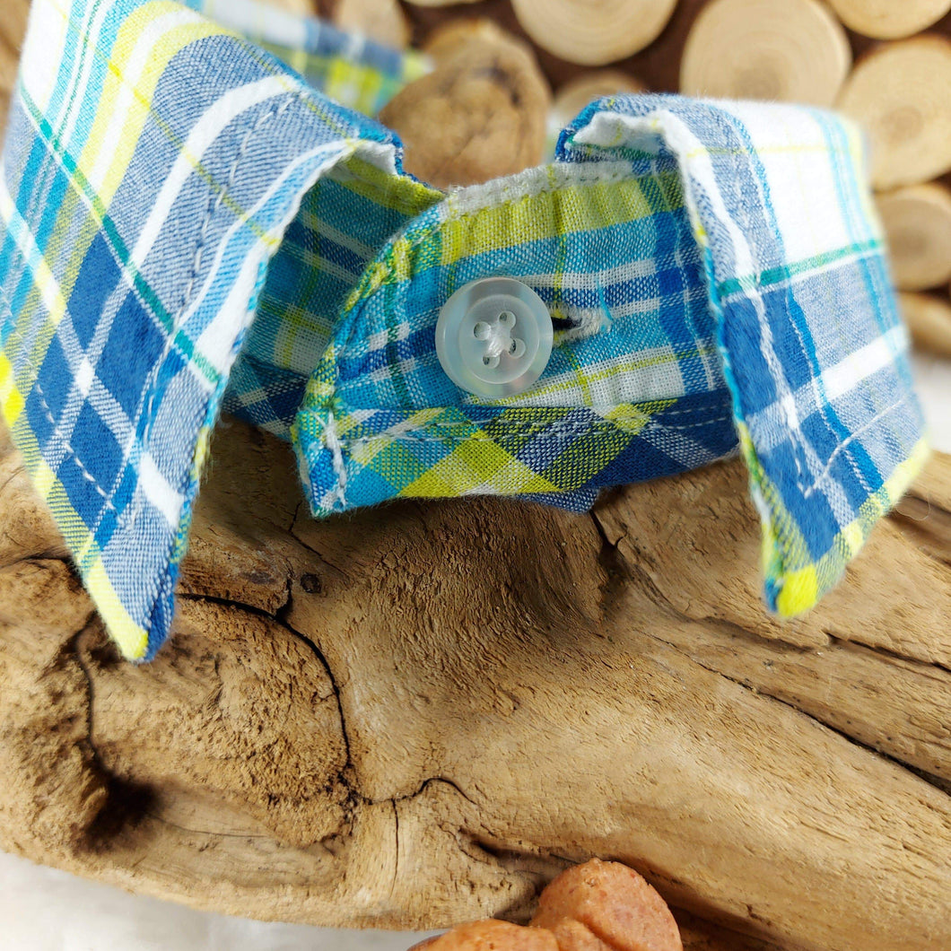Blue/White/Yellow Plaid Dapper Pet Collar. Your dog or cat will look “Oh so handsome” in a snap, with this simple, comfortable and stylish collar available in a variety of classic looks. This dog collar is suitable to be used as a cat collar. The neck size is 14 inches. Made of 100% cotton fabric. Fully washable, dryer friendly and can be ironed as needed. It is recommended that you allow an additional 2 finger widths space for ideal fit. Wiggles and Whiskers Canada Pet Accessories.