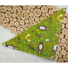Load image into Gallery viewer, Forest Friends/Green Plaid Snap-On Pet Bandana. Over the Collar style Bandana is perfect for dogs and cats on the move because once it’s on it won’t be going anywhere! Slip their collar through the top of the bandana and they can wear it in front, to the side, or at the back. Our bandanas are fully reversible for two different looks – perfect for your style conscious or messy pet. They are also double stitched to last through many washings. Canadian Pet Accessories Company Wiggles &amp; Whiskers
