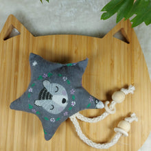 Load image into Gallery viewer, Purple Perfection Star Catnip Toy. Stimulate all your cat’s senses with this catnip toy! Star shaped flannel toy with string dangle with monkey patterns. Measures 5.5” across and 11” in total length. This catnip toy is yellow and orange on one side . The other side of this catnip toy is blue with decorative moon prints. Wiggles and Whiskers Canada Pet Accessories.
